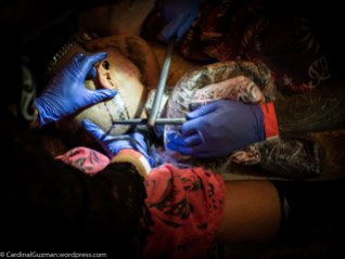 Rosie Edwards is giving Brent Mccown a helping hand while he's tattooing Diogo Nunes.