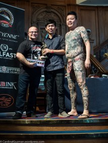 Julian Carson, George Chou and tattoo model.